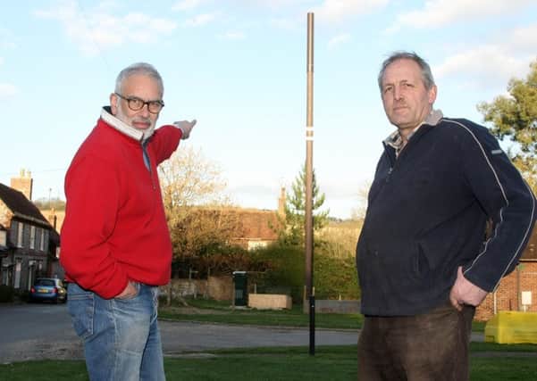DM1932908a.jpg. Villagers in West Marden are furious that a telephone mast has been constructed in the middle of their village. Ranjit V, left and Martin Edney. Photo by Derek Martin Photography. SUS-190326-232224008