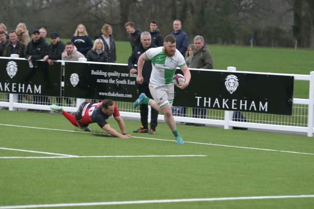 Jack Osgood on his way to score a try for Horsham RUFC. Photo by Clive Turner