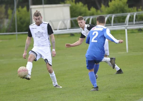 Nathan Lopez tries to intercept a pass during Bexhill United's victory at home to Oakwood earlier this month. Picture by Simon Newstead