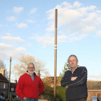 DM1932897a.jpg. Villagers in West Marden are furious that a telephone mast has been constructed in the middle of their village. Ranjit V, left and Martin Edney. Photo by Derek Martin Photography. SUS-190326-232214008