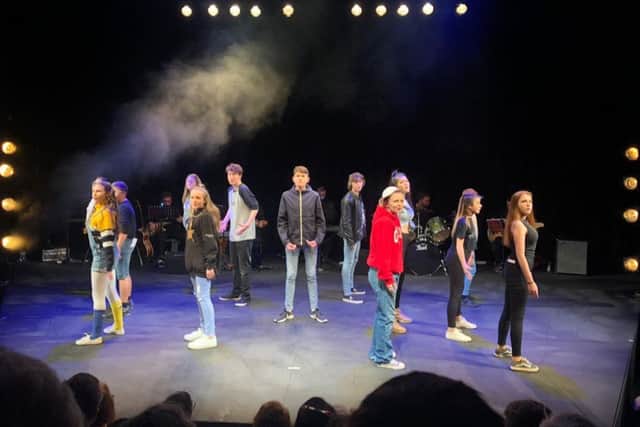 The cast of 13 the musical from Star Ignited Performance Academy on stage at The Other Palace Theatre