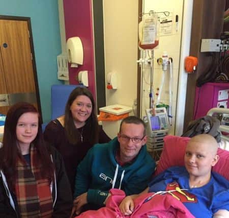 Lauren ]with her family when she was undergoing cancer treatment SUS-190327-143502001