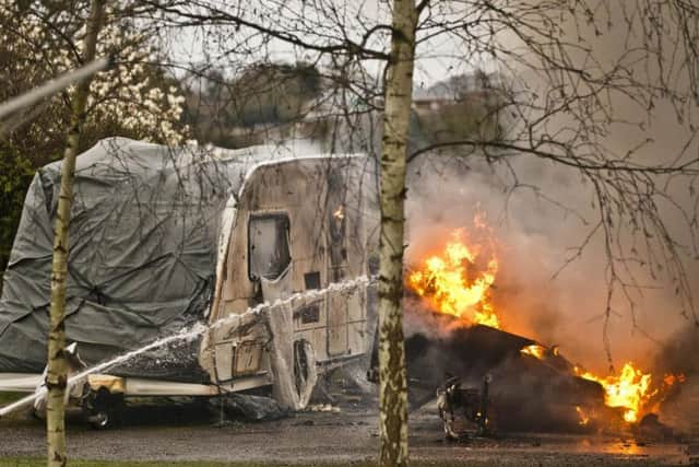 Eight fire engines were called to the blaze which destroyed four caravans and a campervan. Photo by Eddie Howland