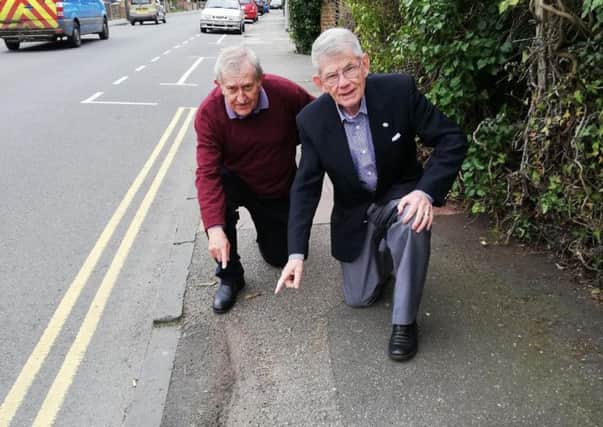 Colin Swansborough and Pat Rodohan, Eastbourne Lib Dem councillors are calling for more money to be spent fixing the town's pavements