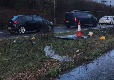 Rubbish and cones on A27