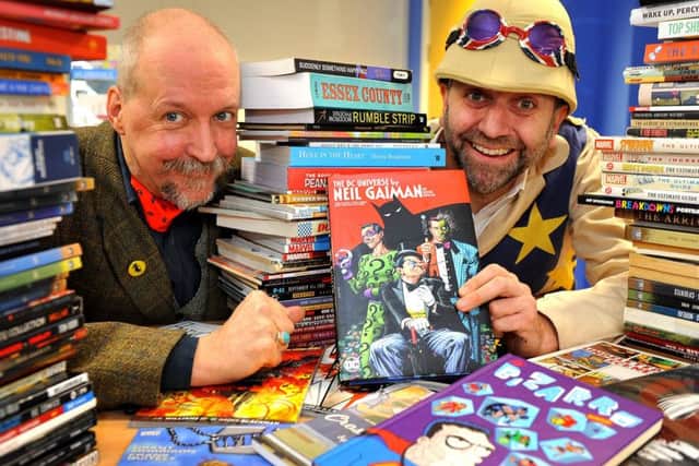 Steampunk hip hop entertainer Professor Elemental, right, presents more than 100 graphic novels to senior library assistant Dan Belton at Southwick Library. Picture: Steve Robards SR1908334
