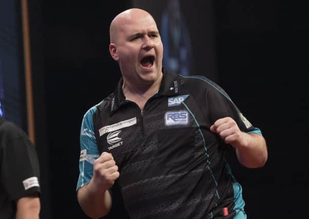 Rob Cross celebrates during his victory over Jeffrey De Zwaan in Rotterdam. Picture courtesy Lawrence Lustig/PDC