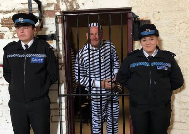 Cadets keep guard over one of the Jail and Bail 'prisoners'. Eastbourne Police 29-03-19