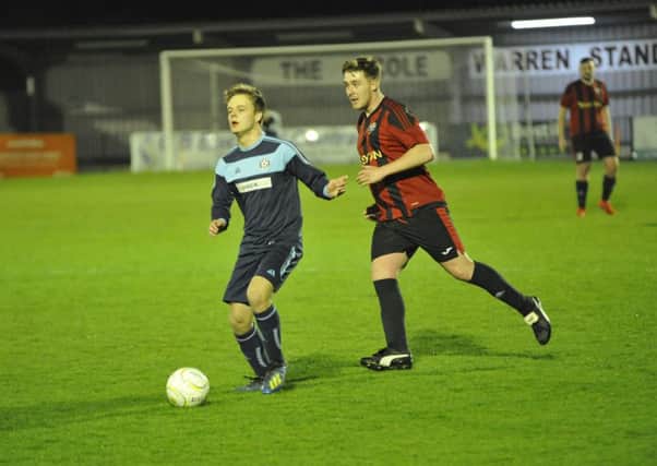 Action from the Wisdens Sports Challenge Cup final between South Coast Athletico (red and black kit) and Victoria Baptists