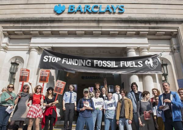 Activists from Brighton Extinction Rebellion stage a Fete of the World outside the branch of Barclays Bank, North St Brighton
Photography www.DFphotography.co.uk
