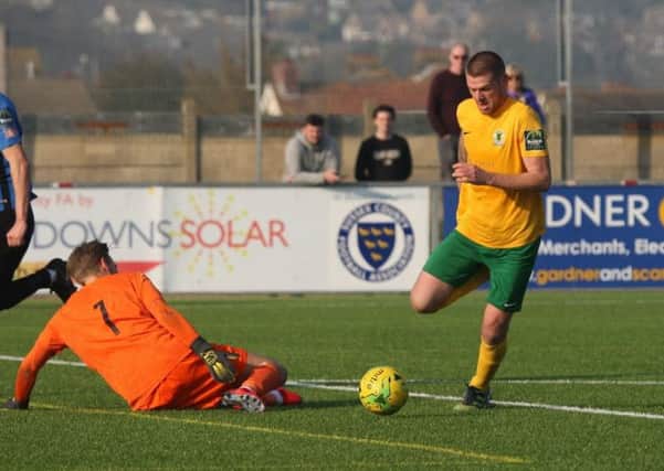 Horsham v Sevenoaks. Rob O'Toole rounds the goalkeeper to slot away his second goal. Picture by John Lines