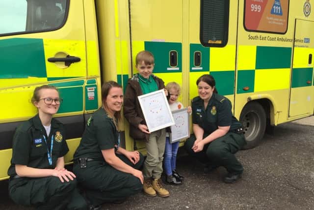 Sean-Michael Corcoran and his sister Aine with Kirsty Clarkson, left, and ambulance staff at SECAmb's Littlehampton response post