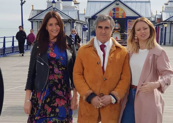 Abid Gulzar with Lisa Snowden and Kimberley Walsh on Eastbourne Pier