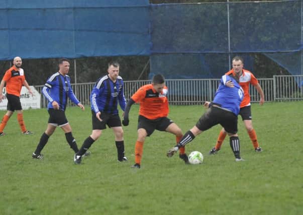 Action from The JC Tackleway's third round victory away to Hollington United II in December. Picture by Simon Newstead