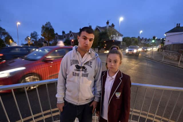 Matthew Zalman and his daughter at the dangerous junction in Victoria Drive and East Dean Road in Eastbourne (Photo by Jon Rigby)