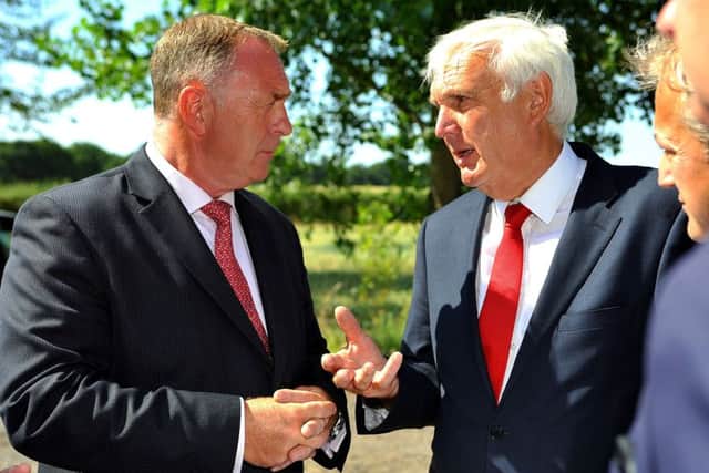 Garry Wall (left), leader of Mid Sussex District Council, pictured last year talking to Homes England chairman Sir Edward Lister