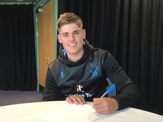 Will Sheffield signs on the dotted line / Picture: Sussex Cricket