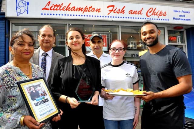Saty Singh, right, with his parents and staff at Littlehampton Fish and Chips, our Herald and Gazette Takeaway of the Year winner. Picture: Steve Robards SR1909034