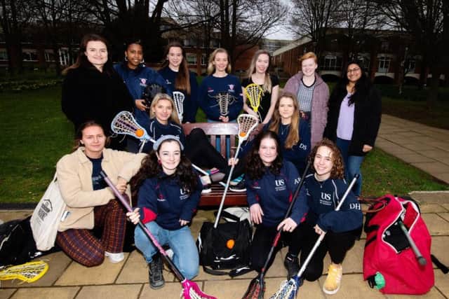 Members of the University of Sussex Women's Lacrosse team and Help the Homeless Society who have recently taken part in fundraising efforts for homeless charities.