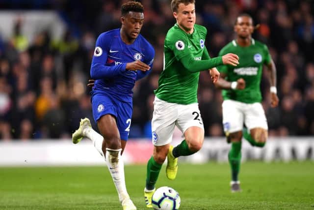 Callum Hudson-Odoi and Solly March battle for the ball.