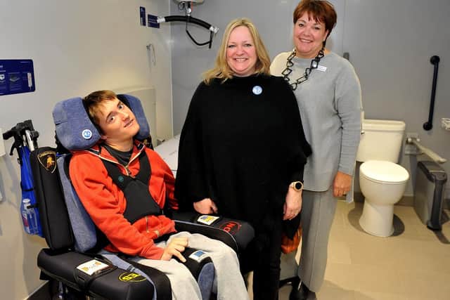 (From left) Alfie and Samantha Buck with Gill Buchanan Swan Walk centre manager in the new Changing Place facility