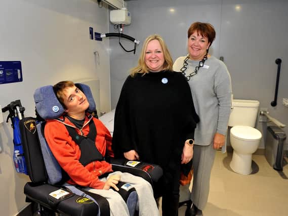 (From left) Alfie and Samantha Buck with Gill Buchanan Swan Walk centre manager in the new Changing Place facility