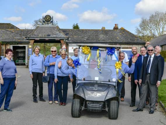 Worthing Golf Club's new captains make an entrance in their buggy
