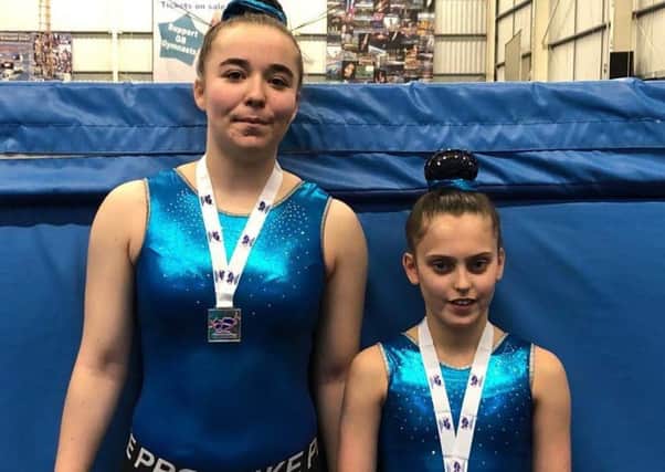 Zara Hyland and Maddie Luke with their medals at the final regional qualifying event