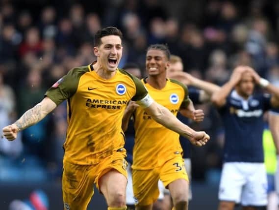 Lewis Dunk celebrates winning at Millwall in the quarter-finals. Picture by Getty Images