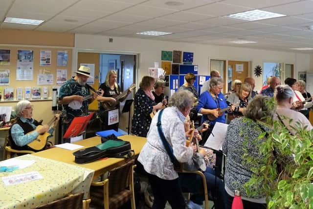 A 30-strong ukulele band, named Sallys Strummers, gathered to honour their former teacher Sally Paice the day before she died. Picture courtesy of St Wilfrid's Hospice