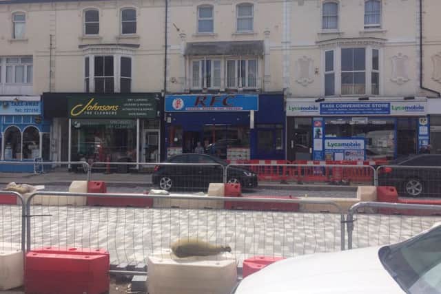 Azram Rahman, manager at RFC takeaway, from the other side of the roadworks in Eastbourne town centre 04-04-19