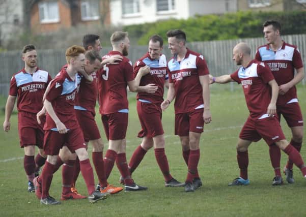 Little Common celebrate scoring in their 4-1 win at home Pagham. Picture by Simon Newstead
