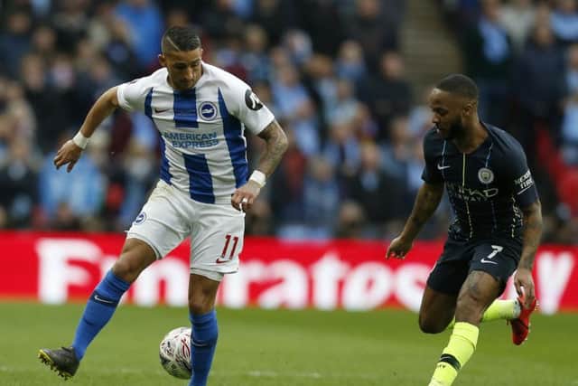 Anthony Knockaert takes on Raheem Sterling. Picture by Getty Images
