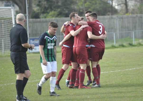 Little Common celebrate their third goal in the 4-1 win at home to Pagham.
