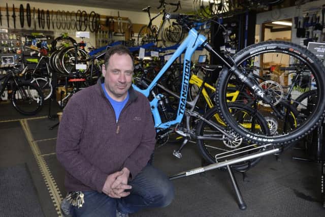 Guy Soper at his Cycletech shop in Westham (Photo by Jon Rigby) SUS-190804-104813008