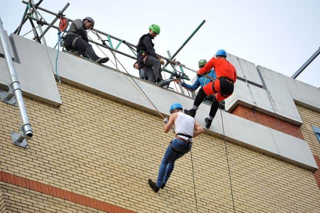 St Catherine's Hospice charity abseil, Crawley.   Pic Steve Robards SR1909097 SUS-190804-104236001