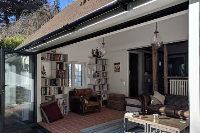 The cottage's large folding glazed doors open out onto the garden. SUS-190804-152249001