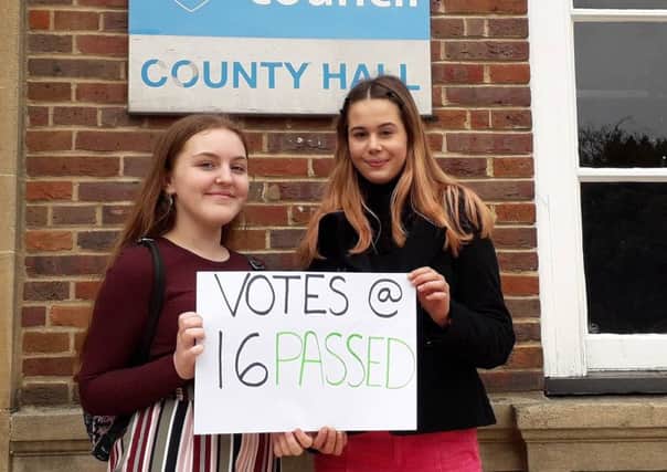 Members of the West Sussex Youth Cabinet Holly Thompson and Ellie Roberts celebrate county councillors backing votes for 16 and 17 year olds