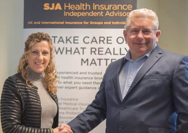 Sally Gunnell OBE with Andrew Leach, managing director of SJA