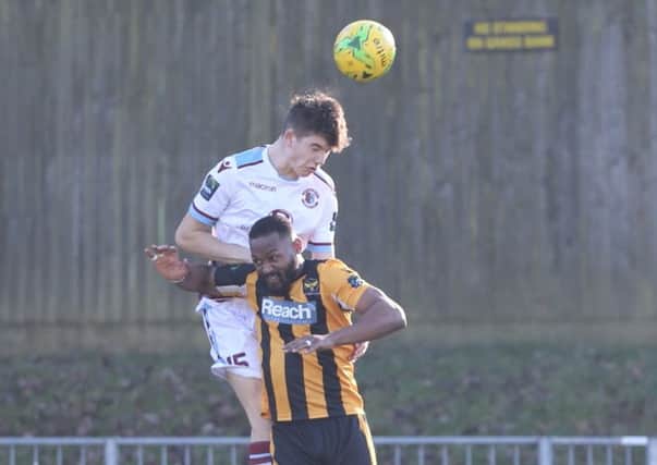 Jamie Fielding wins a header for Hastings United against East Grinstead Town during February. Picture courtesy Scott White
