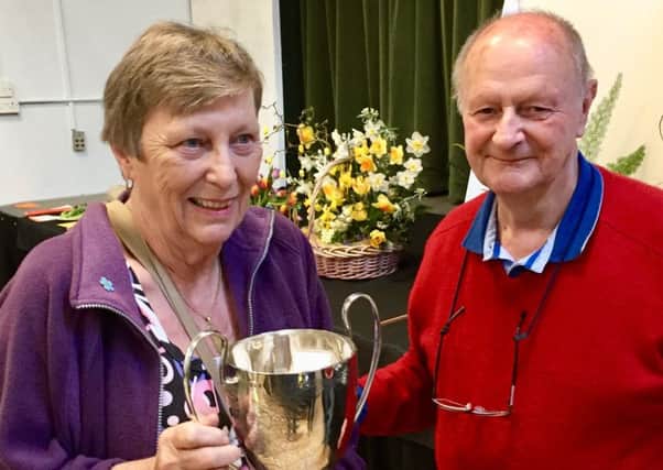 Lyn Southgate receives her trophy from Richard Tabor