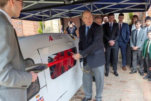 Prince Albert with students and their latest solar car