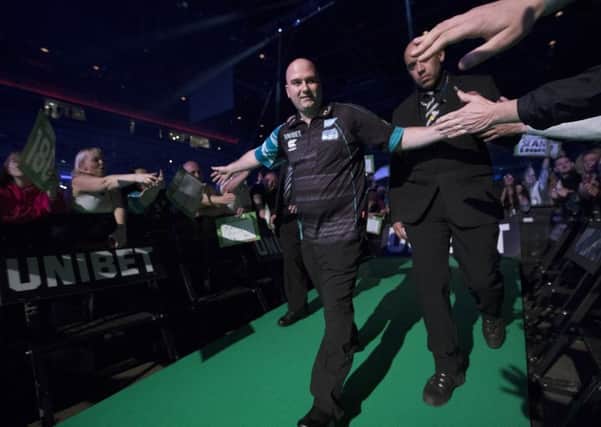 Rob Cross makes his way to the stage before his match against Peter Wright. Picture courtesy Lawrence Lustig/PDC