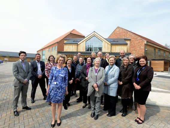The senior management, trustees and the transition project team outside the new Hospice