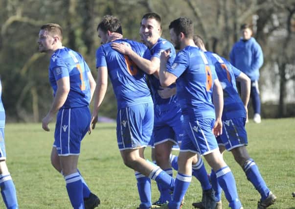 Battle Baptists celebrate their second goal during their National Christian Cup quarter-final win against St Teresa's Norris Green. Picture by Simon Newstead