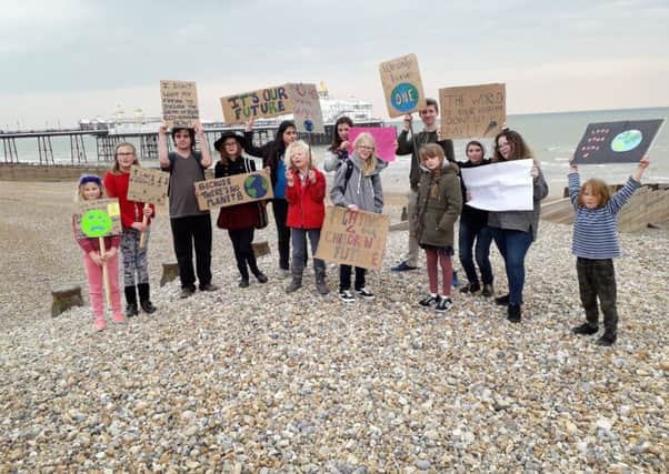 Youngsters strike against climate change on Eastbourne seafront SUS-190416-111602001
