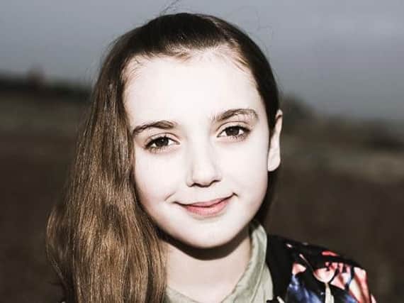 Delilah McNulty, 11, before the head shave challenge