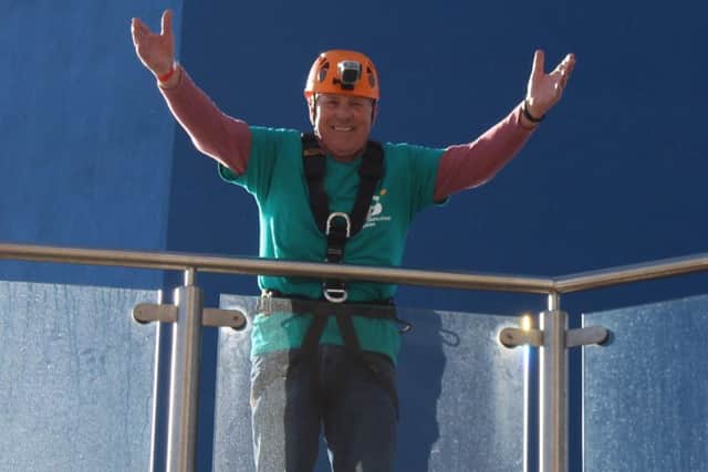 Doug Astle at the Spinnaker Tower Abseil Day for St Barnabas House hospice in Worthing