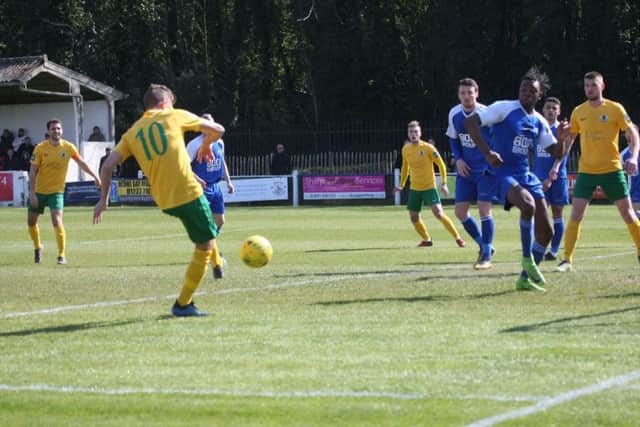 Herne Bay v Horsham. Chris Smith slots home his opener. Picture by John Lines