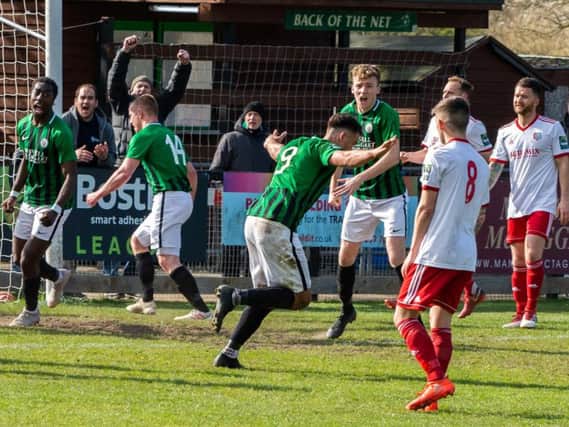 Tommy Wood (centre) celebrates his late equaliser against Brightlingsea Regent. Picture by Chris Neal.